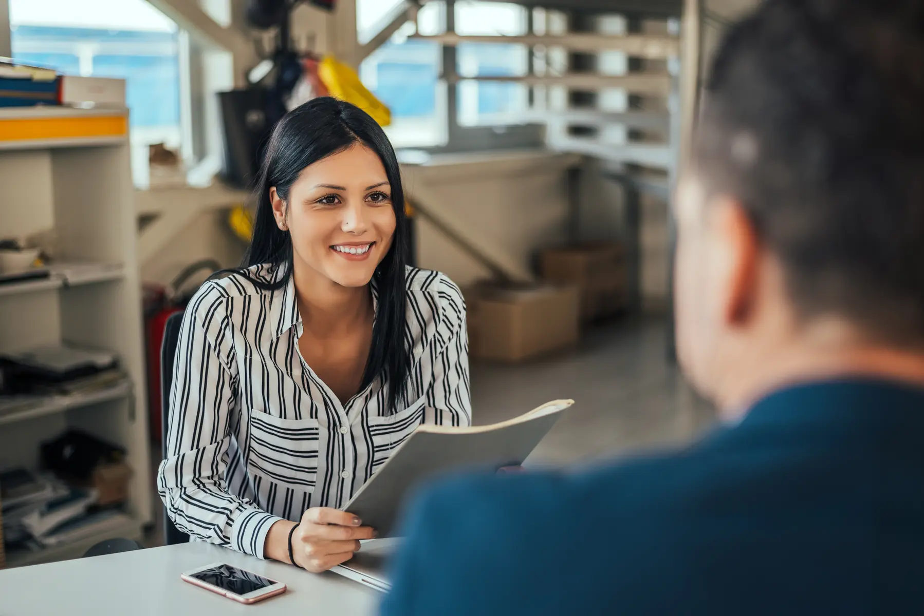 Professional listening to a client during a meeting