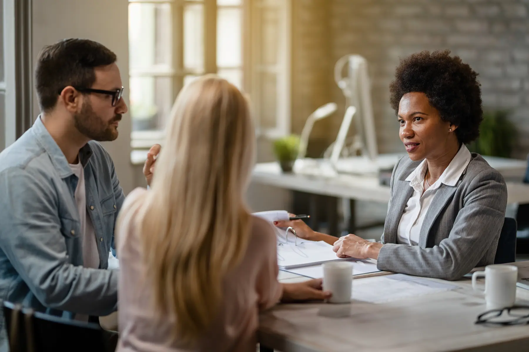 Insurance professional meeting with clients
