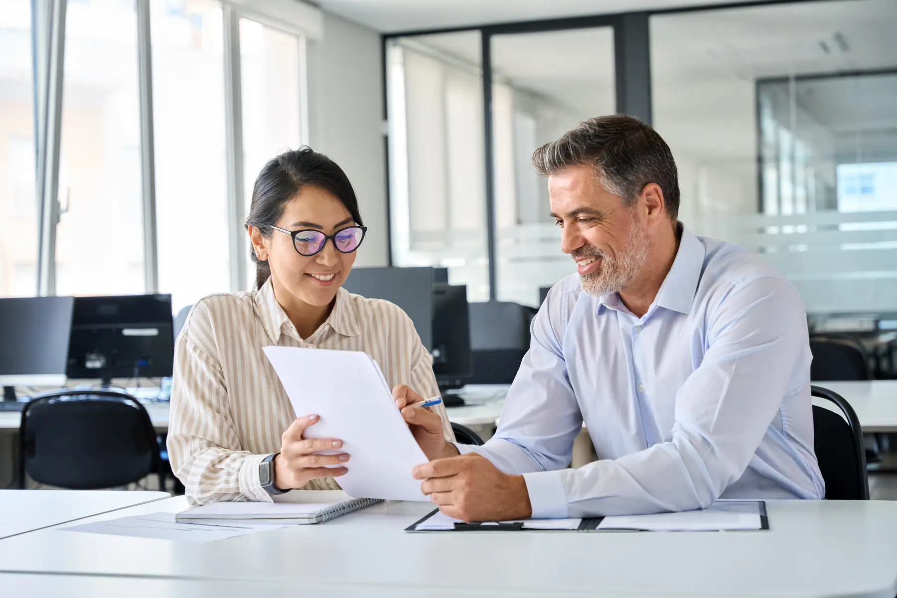 Legal services professionals reviewing documents together