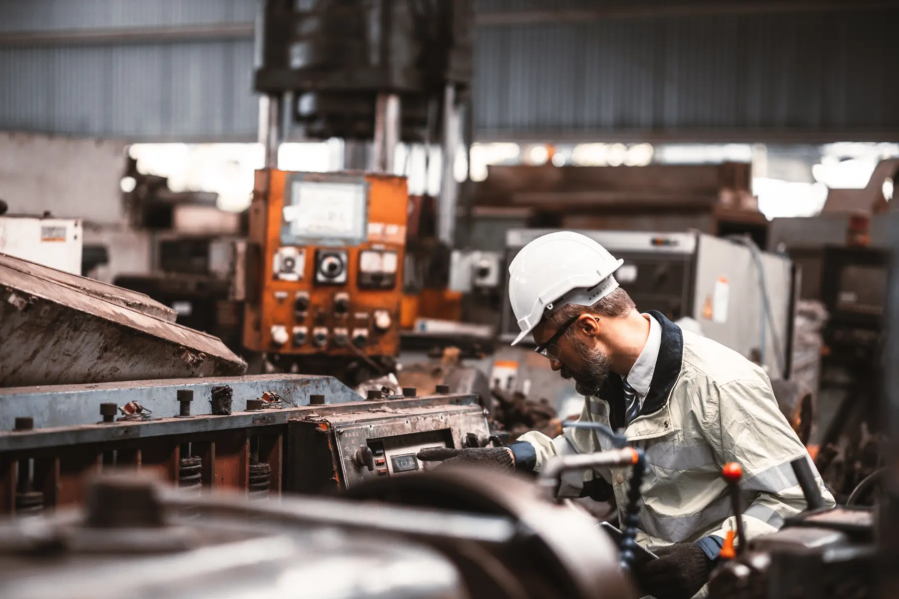 Manufacturing worker operating industrial equipment
