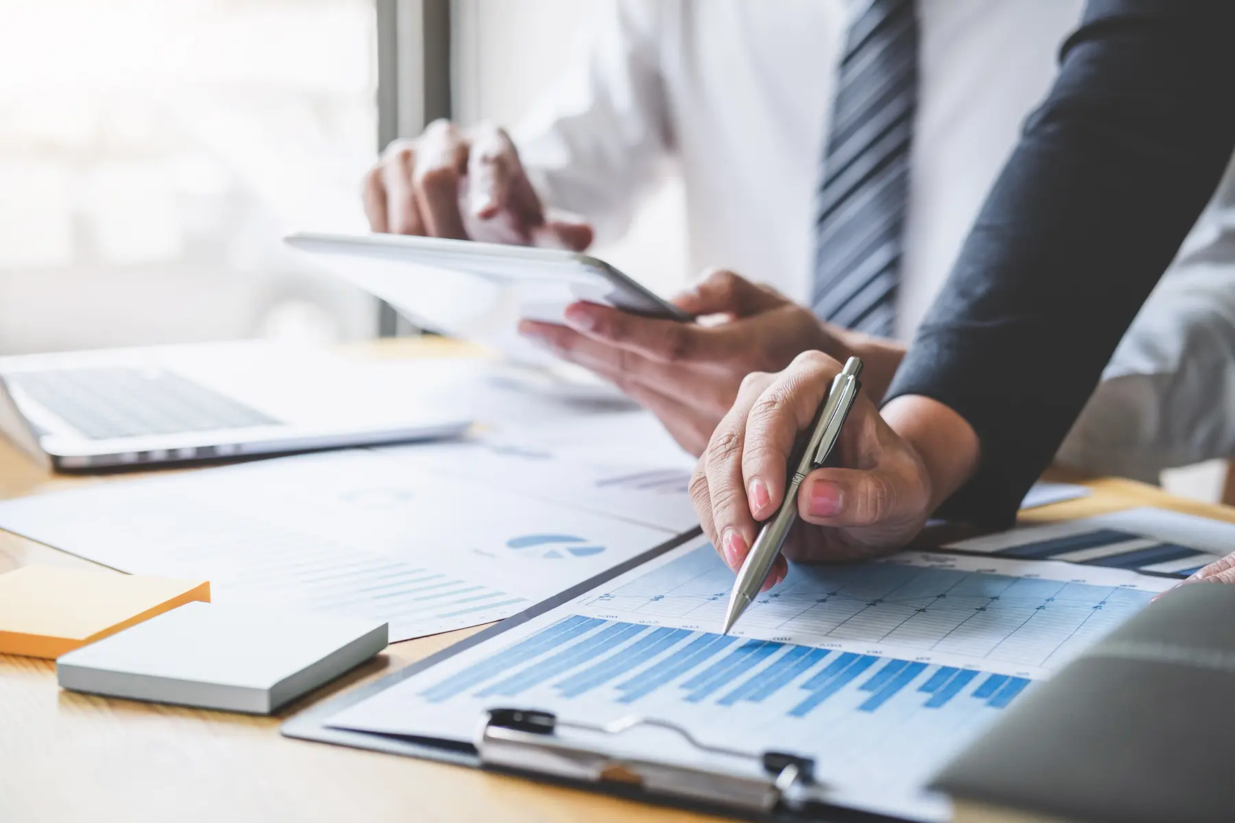 Business advisers reviewing financial data