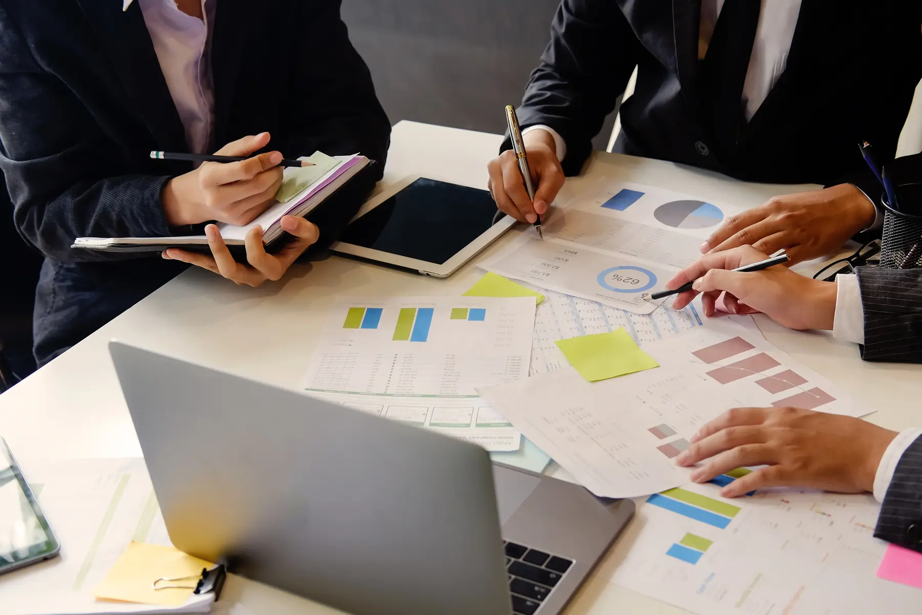 Professionals reviewing financial reports at a table