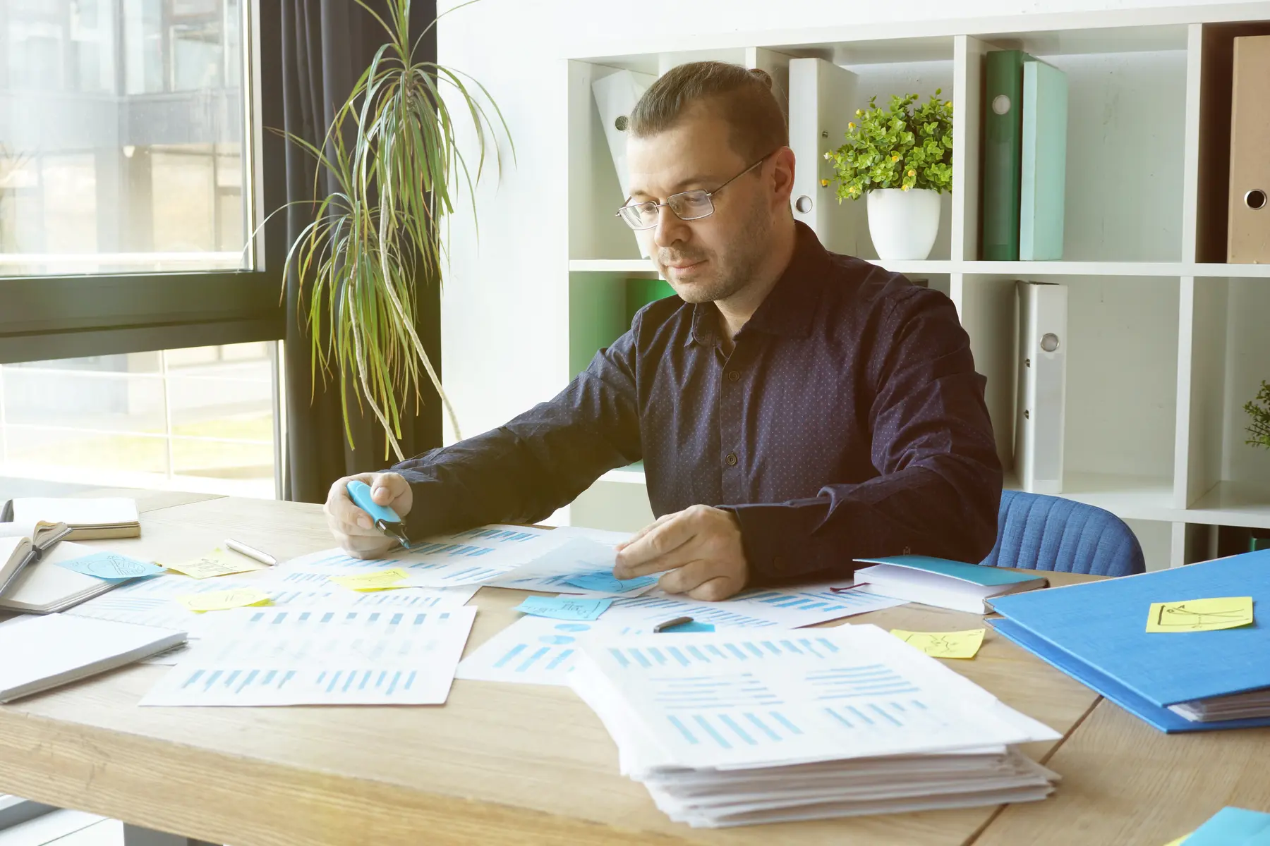 Professional reviewing financial risk reports