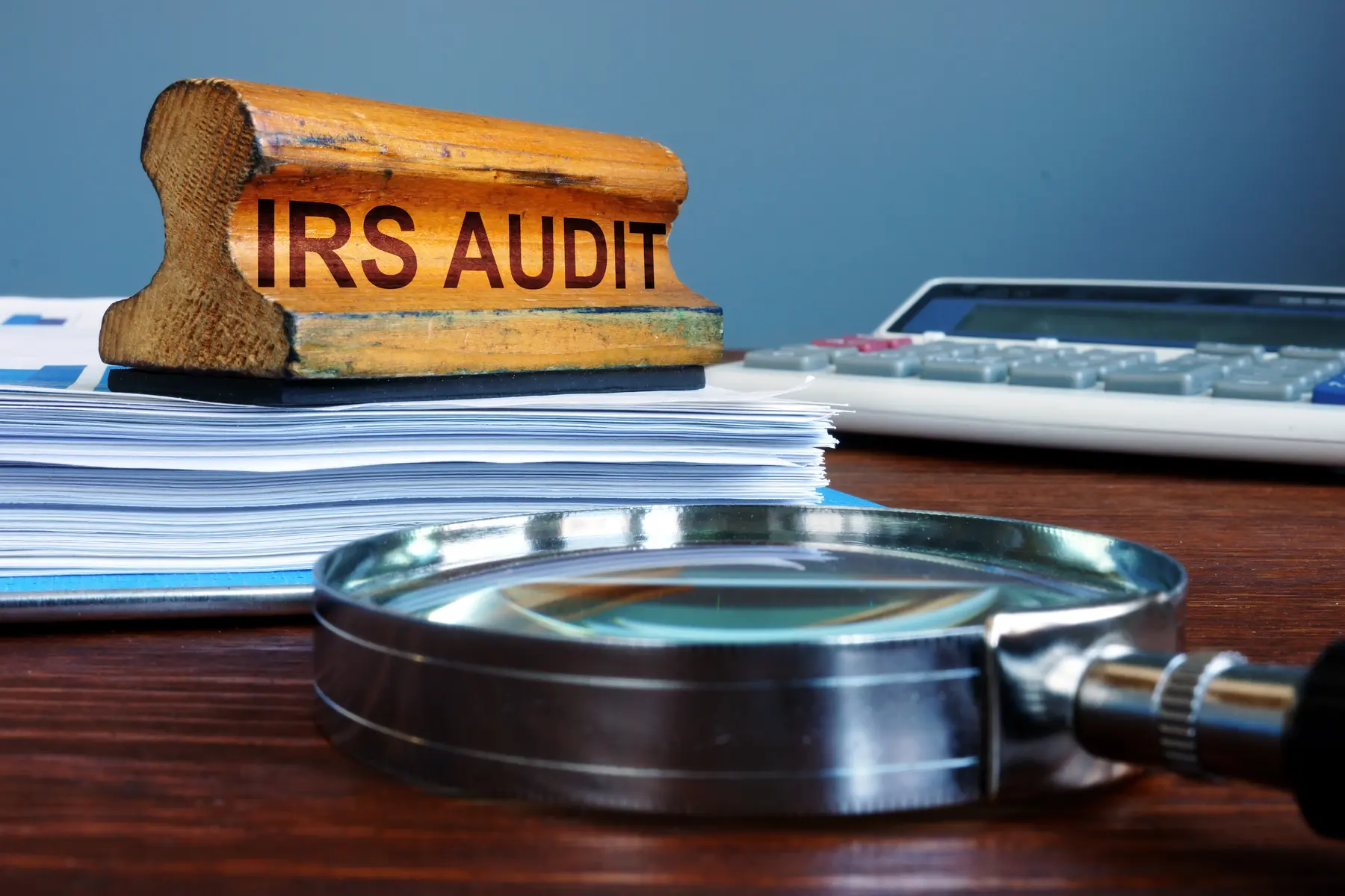 IRS audit documents and magnifying glass
