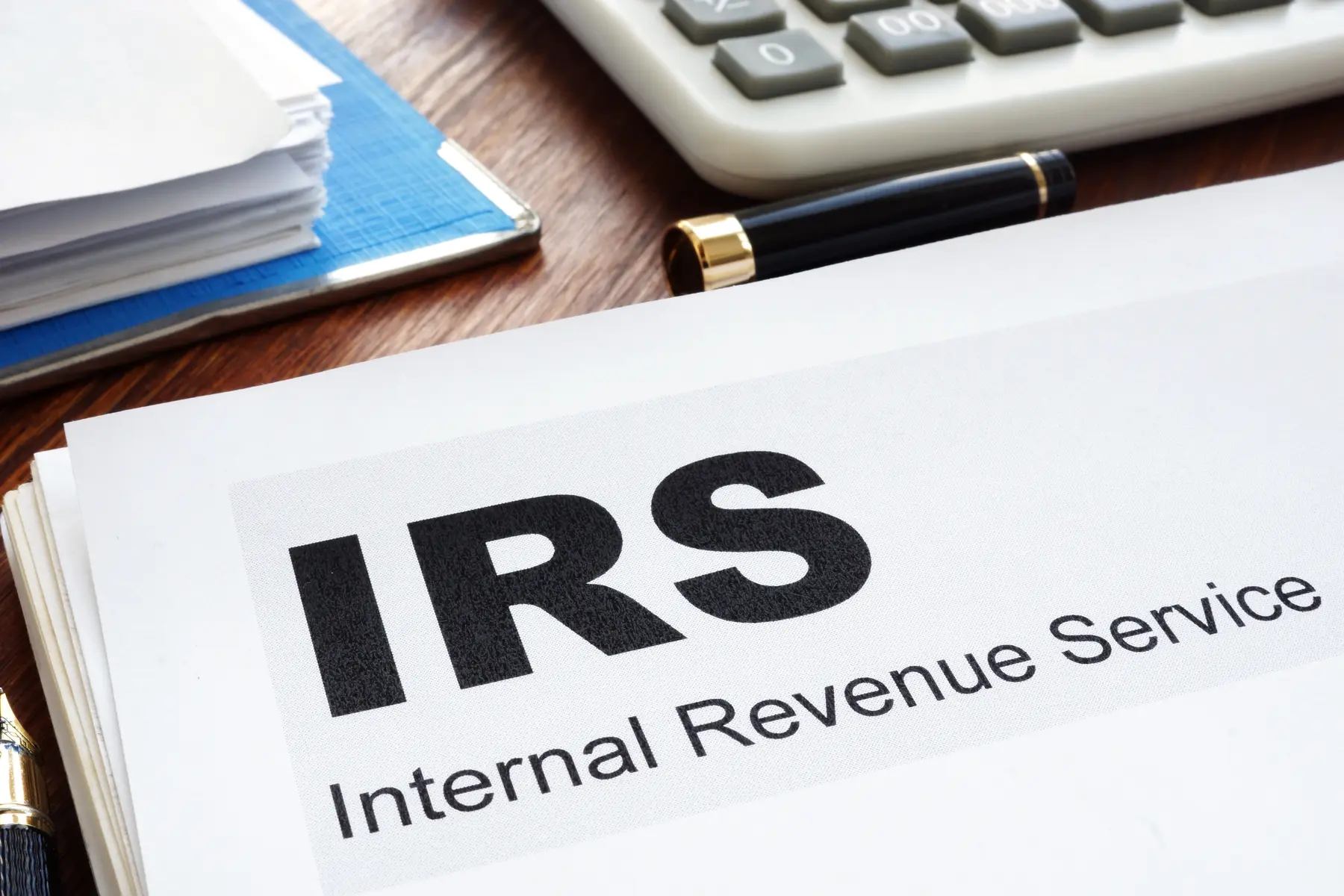 IRS documents, calculator, and financial records
