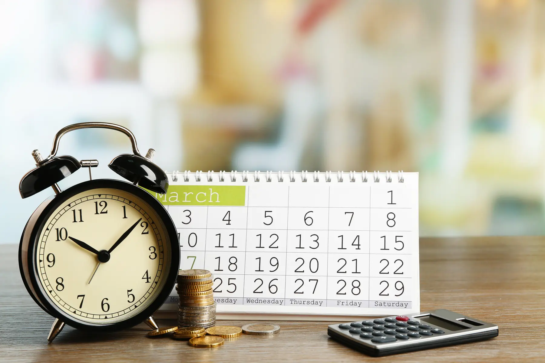 Calendar, clock, coins, and calculator