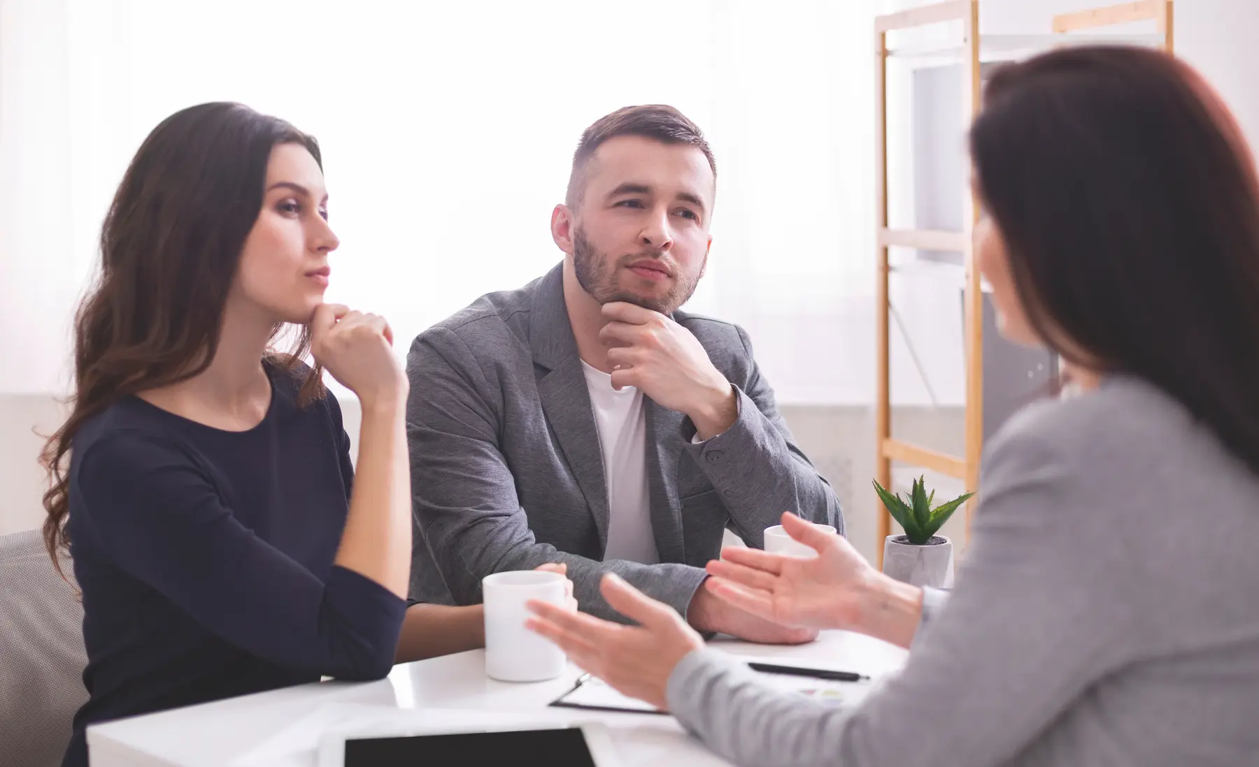 Couple meeting with a private client adviser