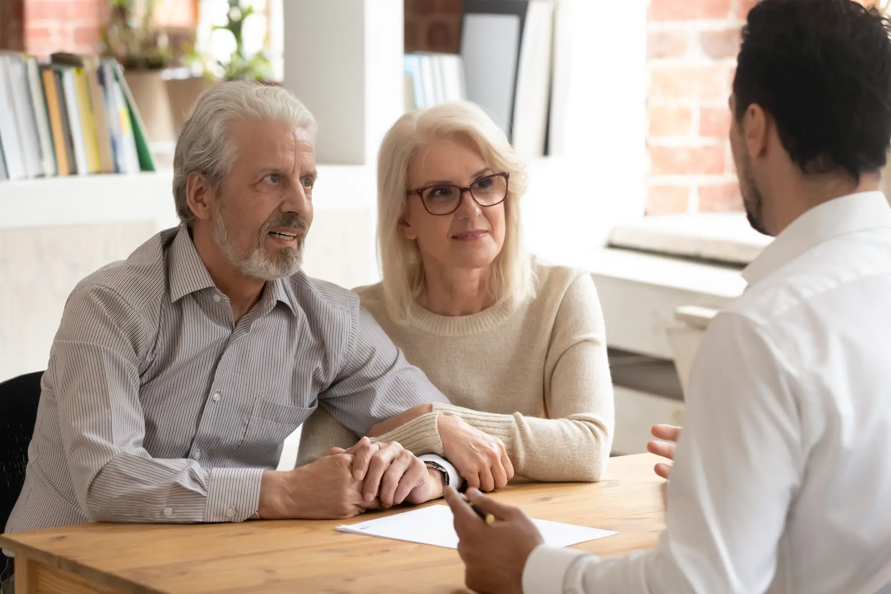 Older couple meeting with a financial adviser